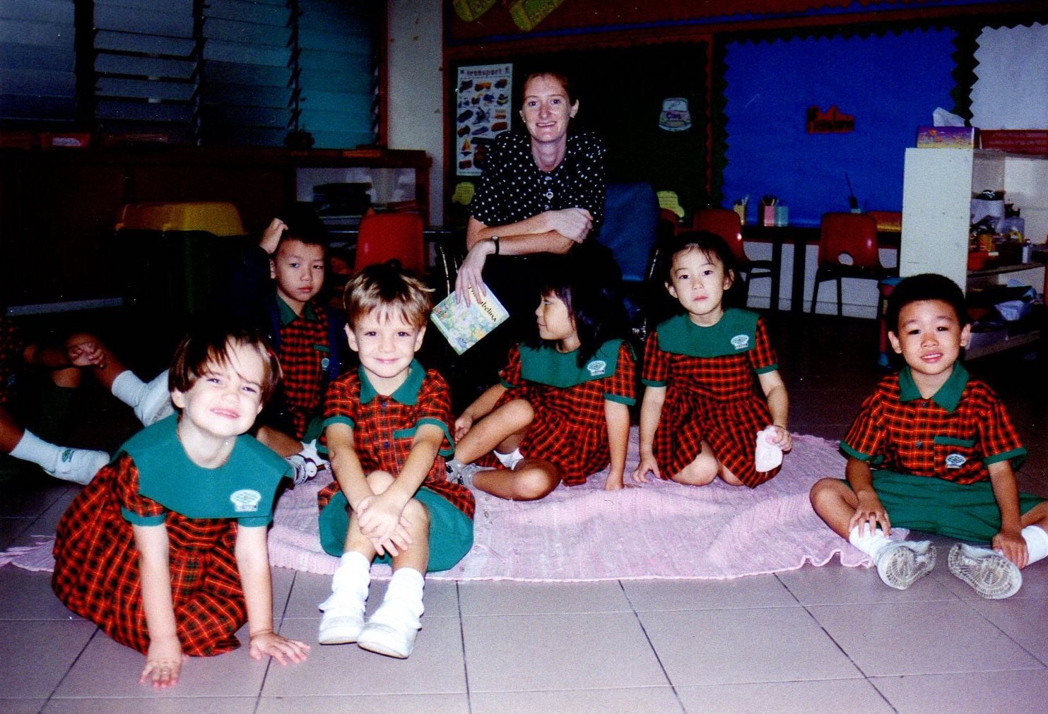 Miss McDonald reads a story to her class & Miss Lim is teaching Mandarin & Computers in the classroom