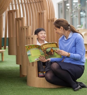 EtonHouse Blog - Give the child the gift of your time and a simple shared moment of reading a book 